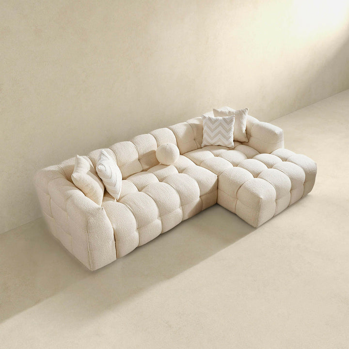 Alana Tufted Ivory Boucle Right Sectional Sofa.